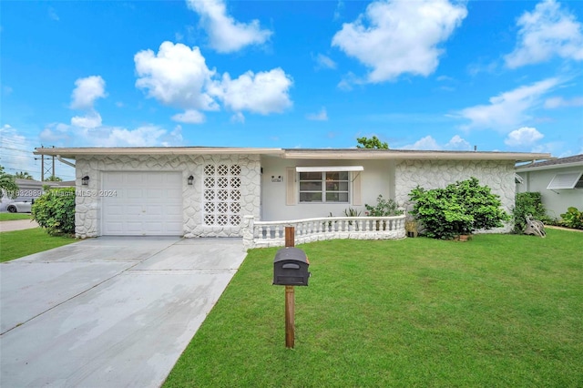 single story home with a garage and a front yard