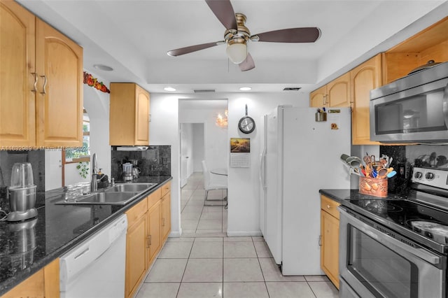 kitchen featuring stainless steel appliances, sink, decorative backsplash, light tile patterned flooring, and ceiling fan