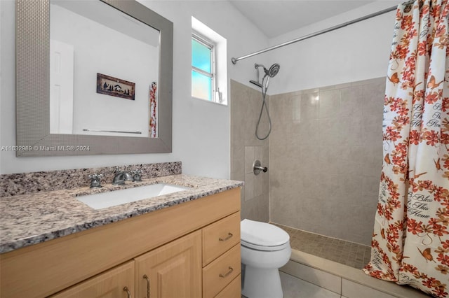 bathroom with vanity, walk in shower, and toilet