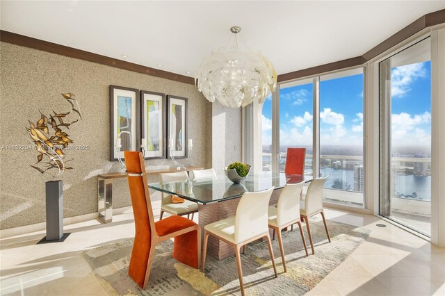 dining room with a water view, expansive windows, and a notable chandelier