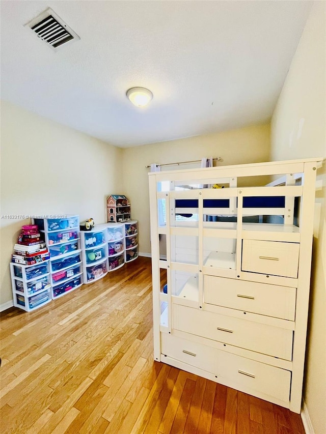 bedroom with light hardwood / wood-style floors