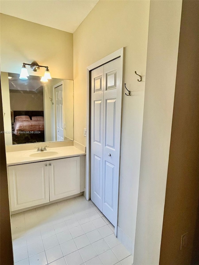 bathroom with tile patterned floors and vanity