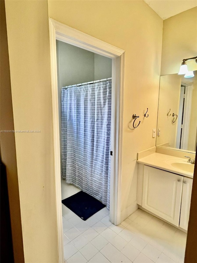 bathroom with vanity and tile patterned flooring