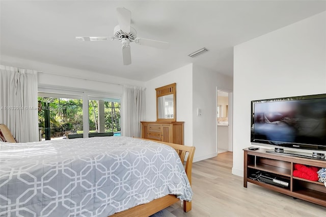 bedroom featuring ceiling fan, baseboards, visible vents, and light wood-type flooring