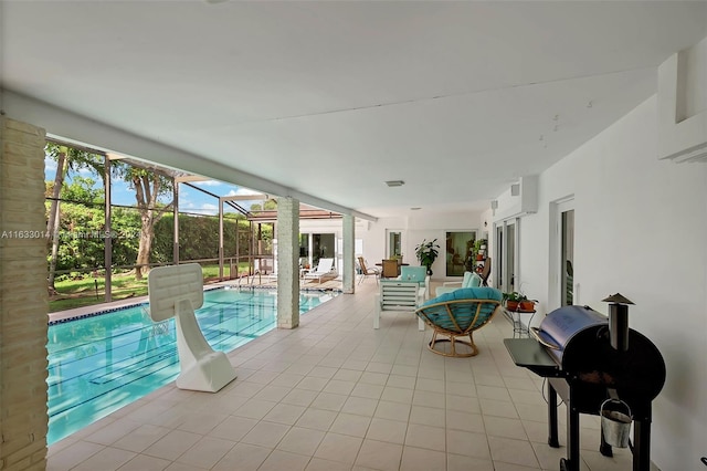 view of swimming pool with glass enclosure, a patio, a fenced in pool, and grilling area