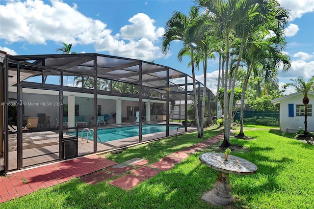 view of swimming pool featuring a fenced in pool, glass enclosure, a yard, and fence