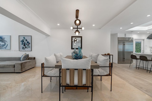 dining space with crown molding