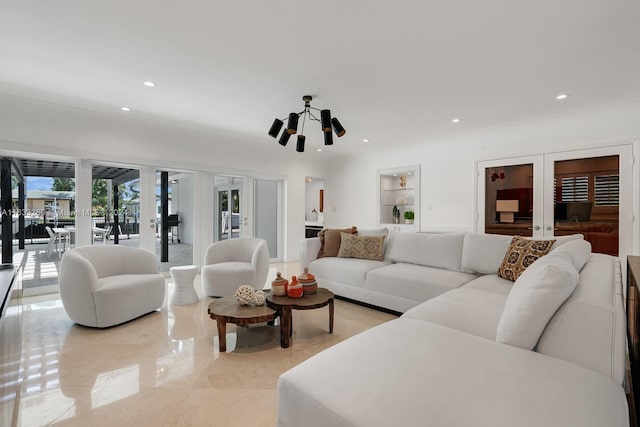 living room featuring built in features and french doors