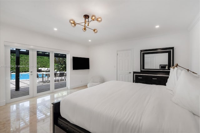 bedroom featuring french doors, a chandelier, and access to exterior