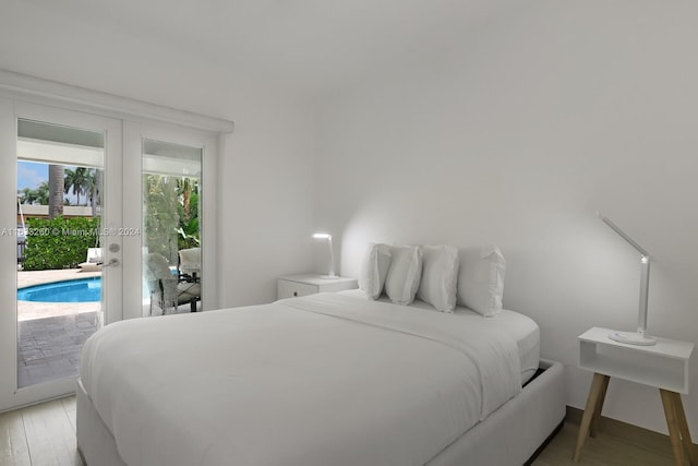 bedroom with light wood-type flooring, french doors, and access to exterior