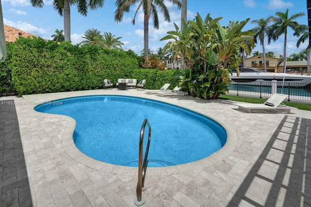 view of pool with an outdoor hangout area and a patio area