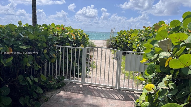 view of gate featuring a water view