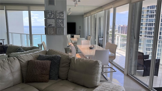 dining area featuring expansive windows and light tile patterned flooring