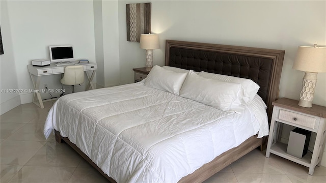 bedroom featuring light tile patterned flooring