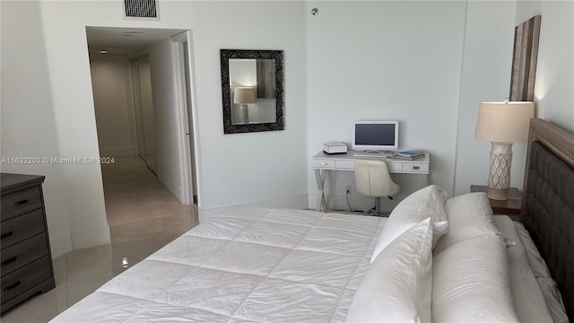 bedroom featuring light tile patterned floors