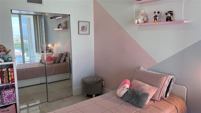 bedroom with tile patterned floors