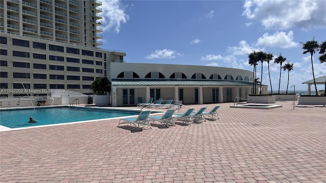 view of pool featuring a patio area