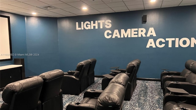 interior space with carpet and a drop ceiling