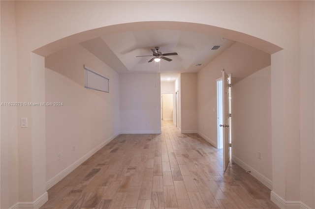 empty room featuring ceiling fan and light wood-type flooring