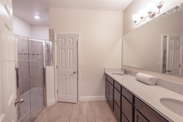 bathroom with vanity and an enclosed shower