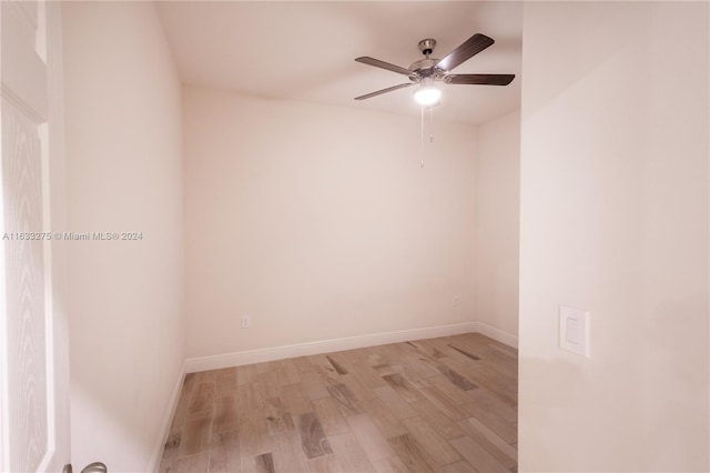 spare room featuring light hardwood / wood-style floors and ceiling fan