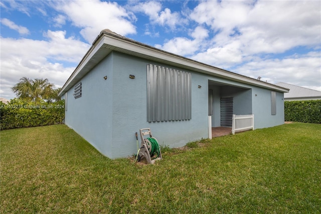 view of home's exterior featuring a lawn