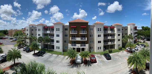 view of property with uncovered parking