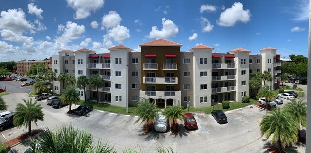 11060 SW 196th St Unit 214, Cutler Bay, FL 33157 - view of property with uncovered parking