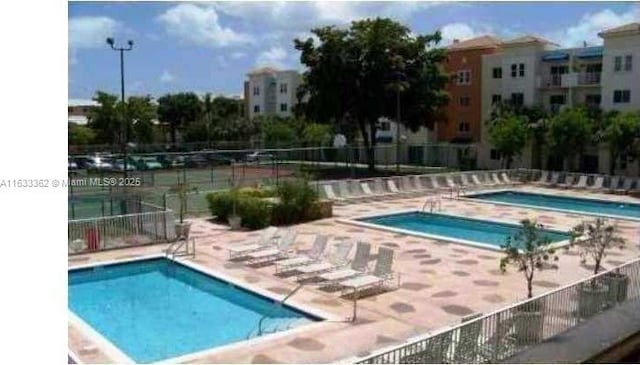 view of swimming pool with a patio