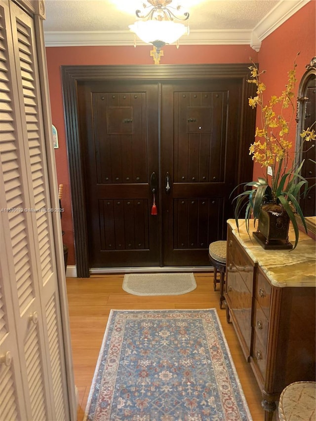 interior space with light hardwood / wood-style floors and crown molding