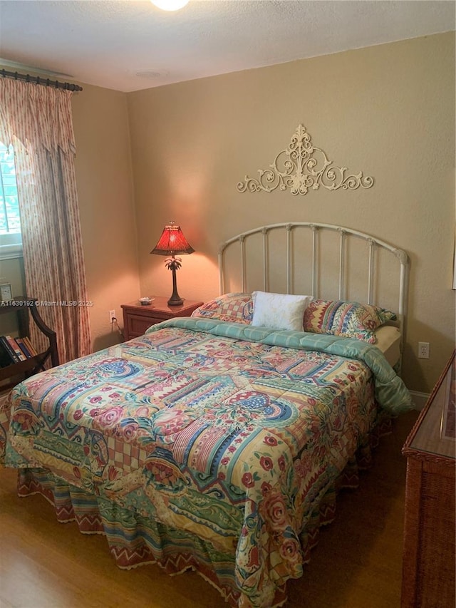 bedroom featuring hardwood / wood-style flooring