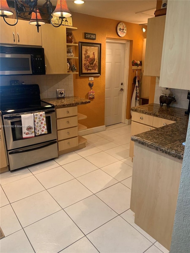 825 El Rado St, Coral Gables, FL 33134 - kitchen with stainless steel electric range oven, tasteful backsplash, dark countertops, light tile patterned flooring, and open shelves