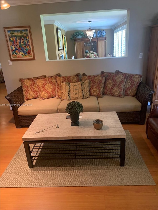 825 El Rado St, Coral Gables, FL 33134 - living room with crown molding, wood finished floors, and a chandelier