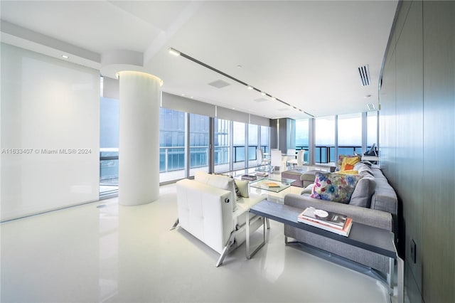 living room with floor to ceiling windows