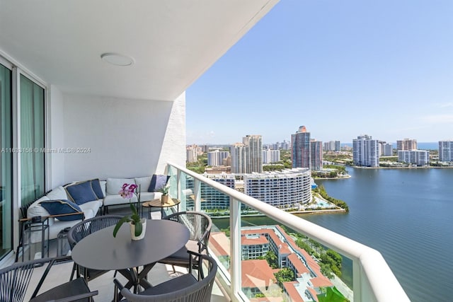 balcony featuring a water view