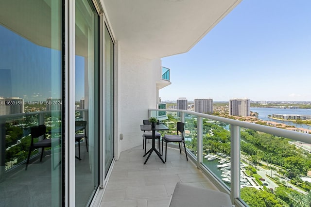 balcony featuring a water view