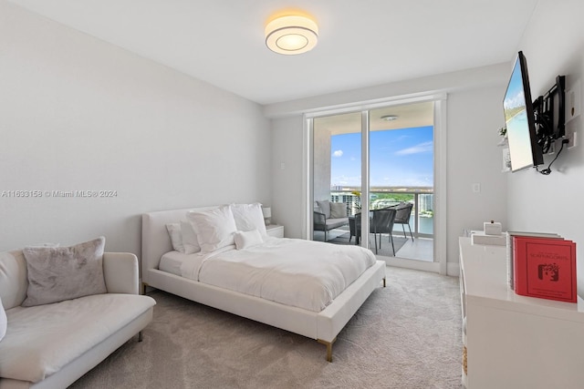 carpeted bedroom featuring access to outside