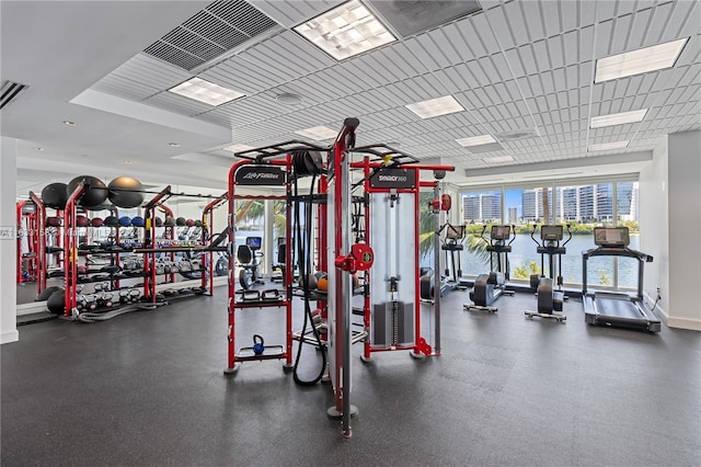 gym featuring a water view