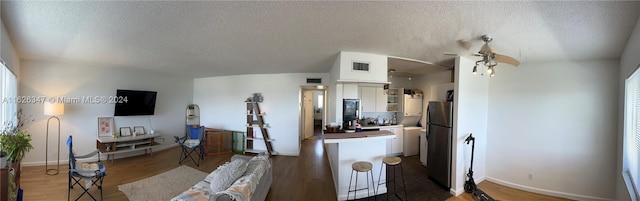 interior space featuring hardwood / wood-style floors and a textured ceiling