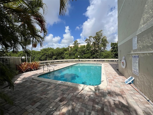 view of pool featuring a patio area