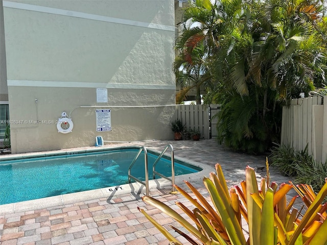 view of swimming pool featuring a patio