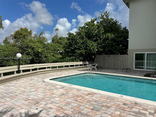 view of pool featuring a patio