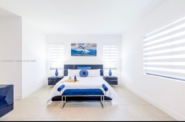 bedroom with light tile patterned flooring