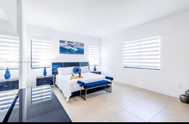 bedroom with light tile patterned flooring