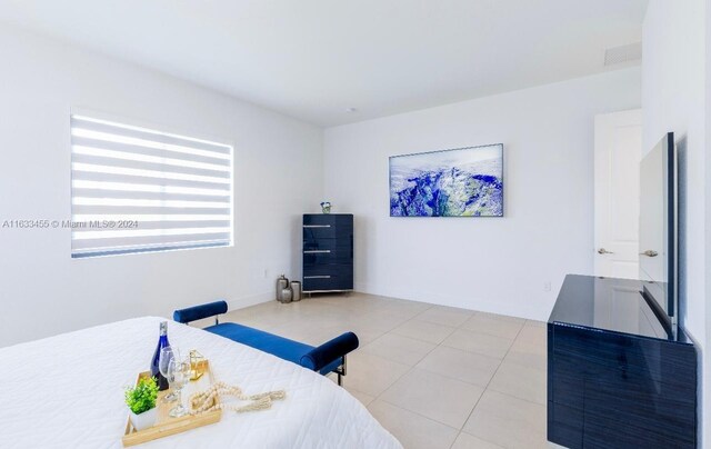 bedroom with light tile patterned flooring