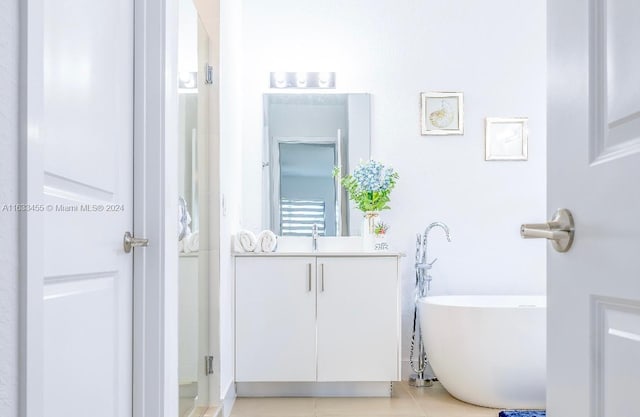 bathroom with vanity, separate shower and tub, and tile patterned flooring