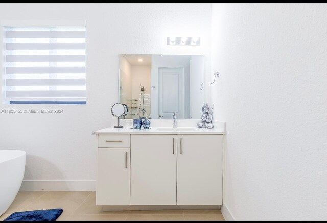 bathroom with vanity and tile patterned floors