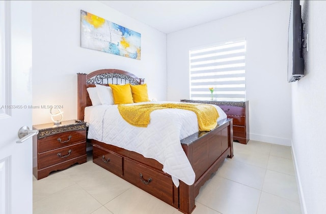 bedroom with light tile patterned floors