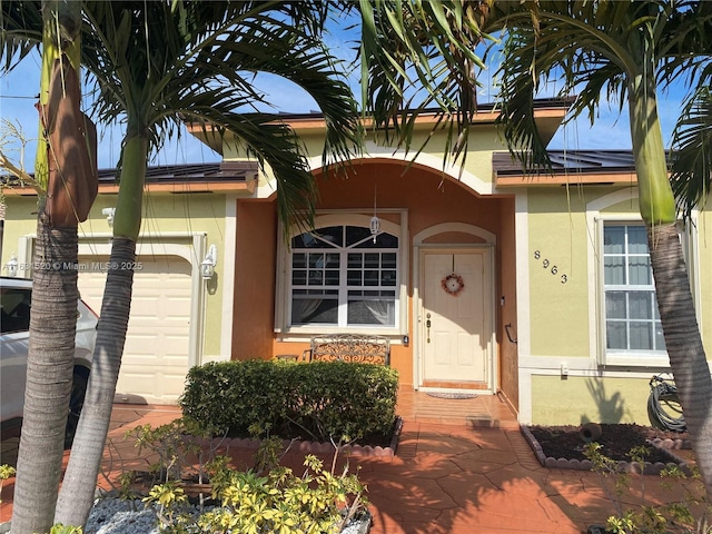 doorway to property featuring a garage