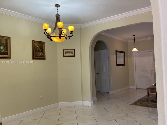 empty room featuring an inviting chandelier, light tile patterned flooring, and crown molding